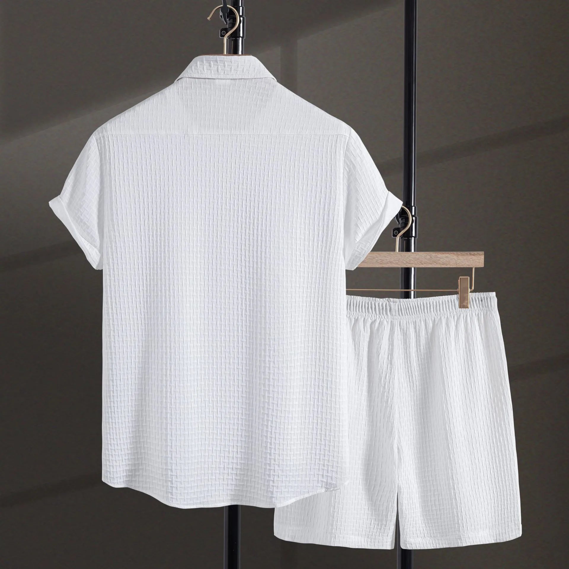 Men's black cotton blend short sleeve shirt and shorts casual summer suit on a hanger.