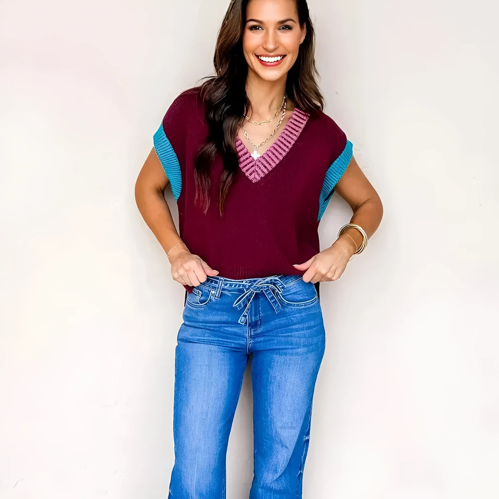 Burgundy women's loose V-neck sweater with contrast trim on cuffed short sleeves