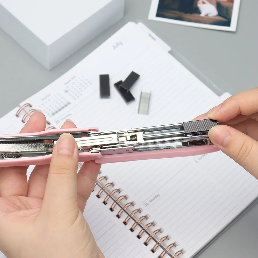 Box of 1000 metal office staples in rose gold, black, purple, and rose red colour options