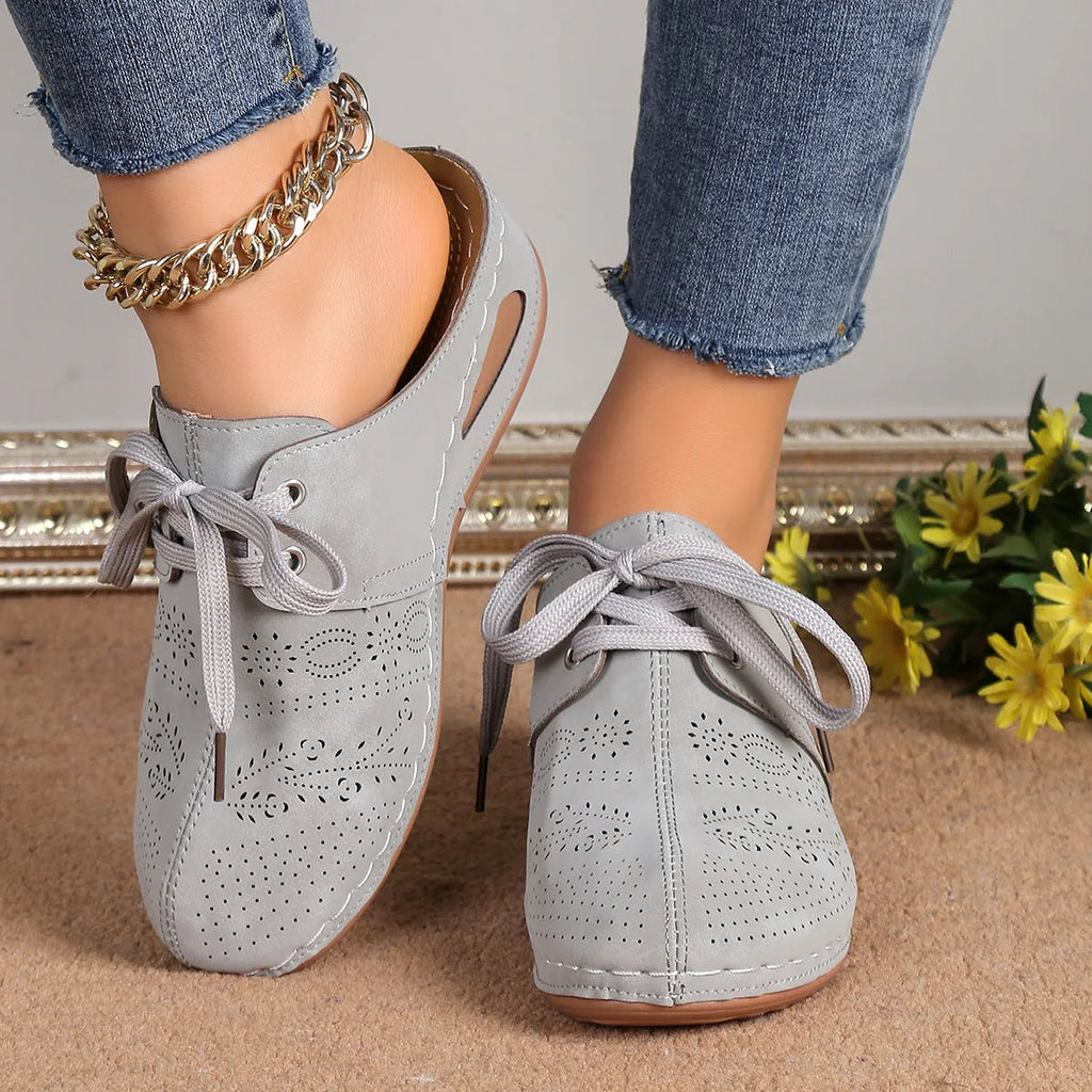 Women's light grey suede lace-up wedge slippers with a hollow-out rubber sole.