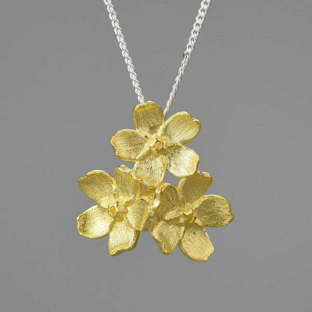 Sterling silver forget-me-not flower pendant with open mouth pastoral design