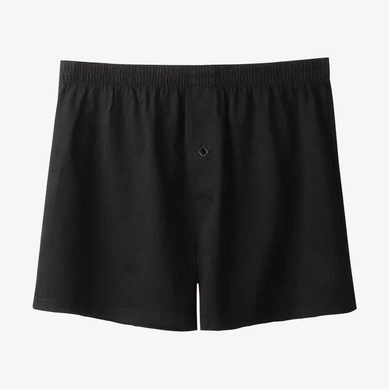 Men's high waist cotton boxer shorts in loose fitting design showing solid colour options