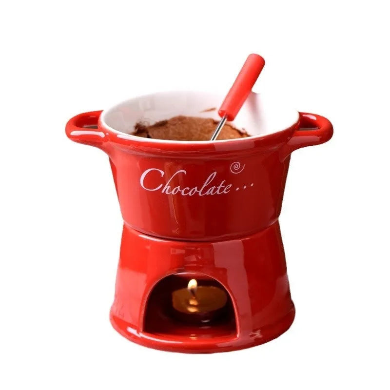 Ceramic binaural hot pot cup in brown for melting chocolate with fork and candle beside it