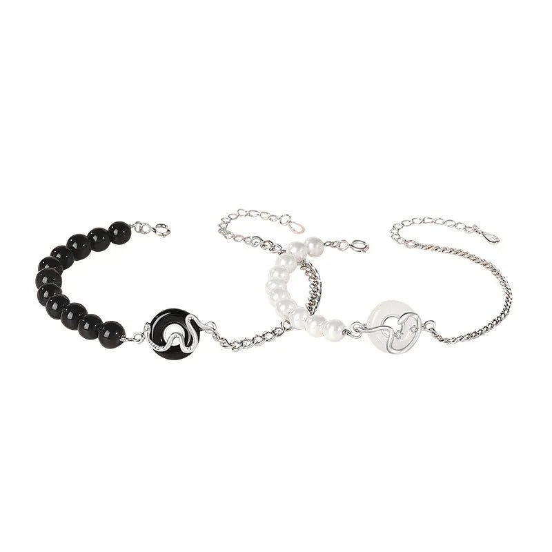 A New Chinese style 925 sterling silver couple bracelet with an obsidian pearl and snake zodiac motif on a secure buckle.