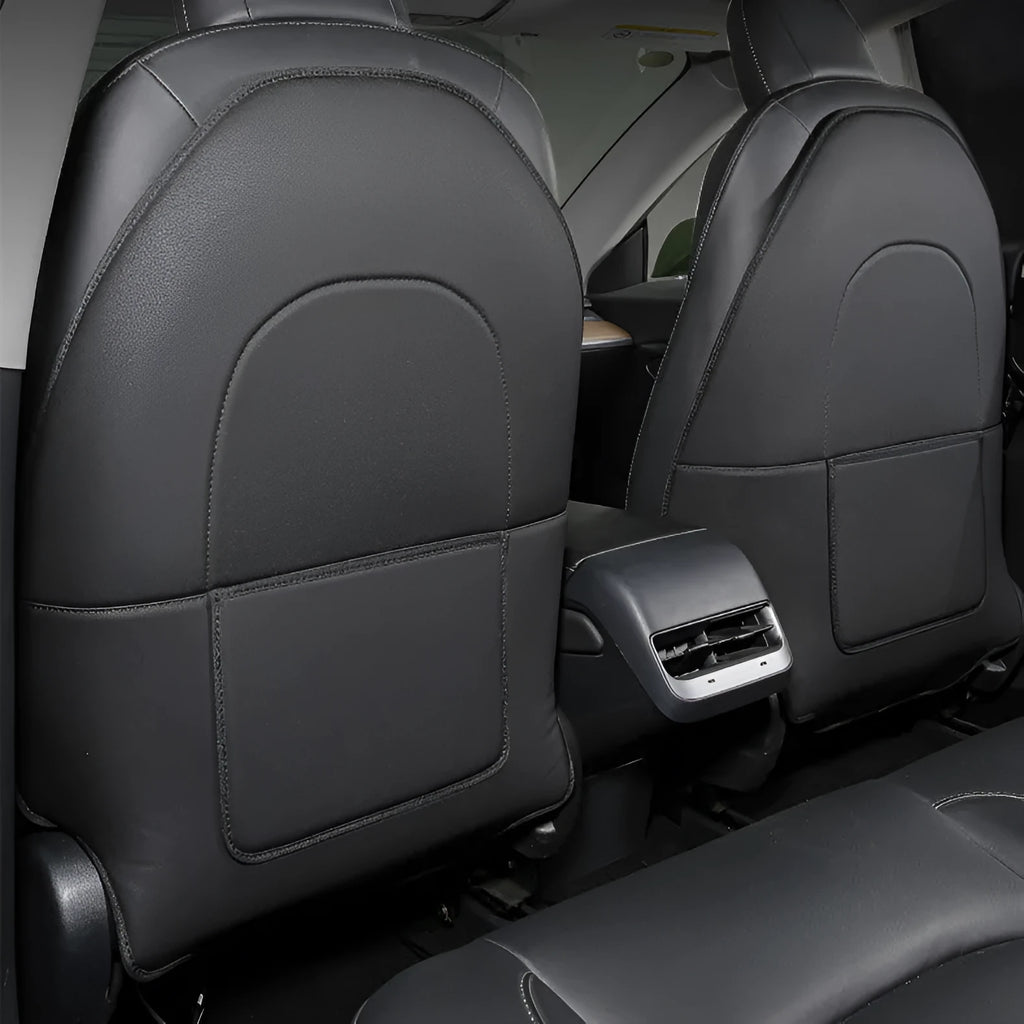 Set of two black leather rear seat anti kick pads with a storage pocket.