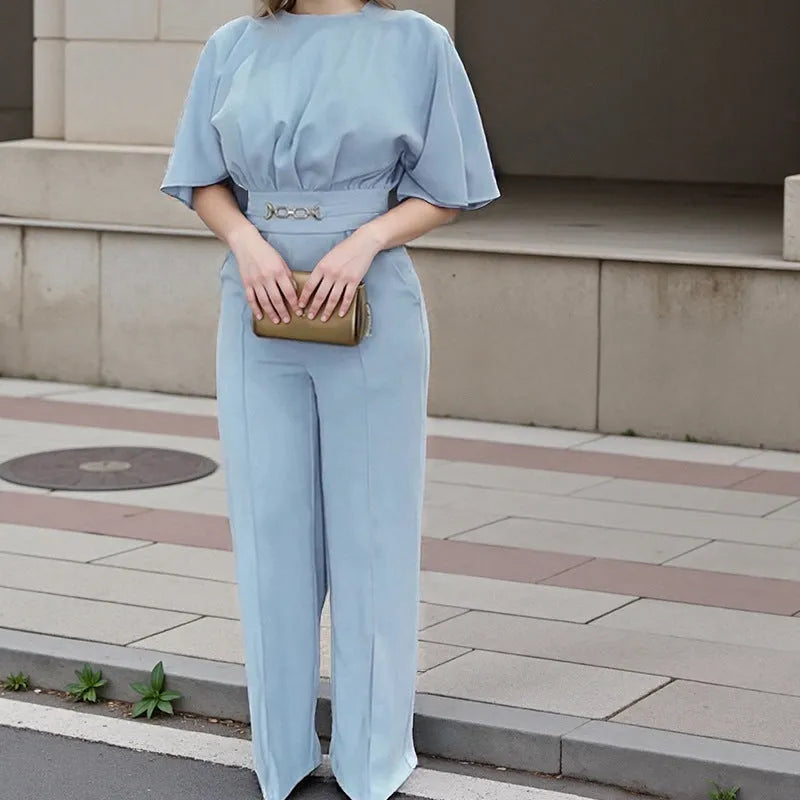 Blue polyester two-piece men's suit with long sleeves and trousers on a hanger