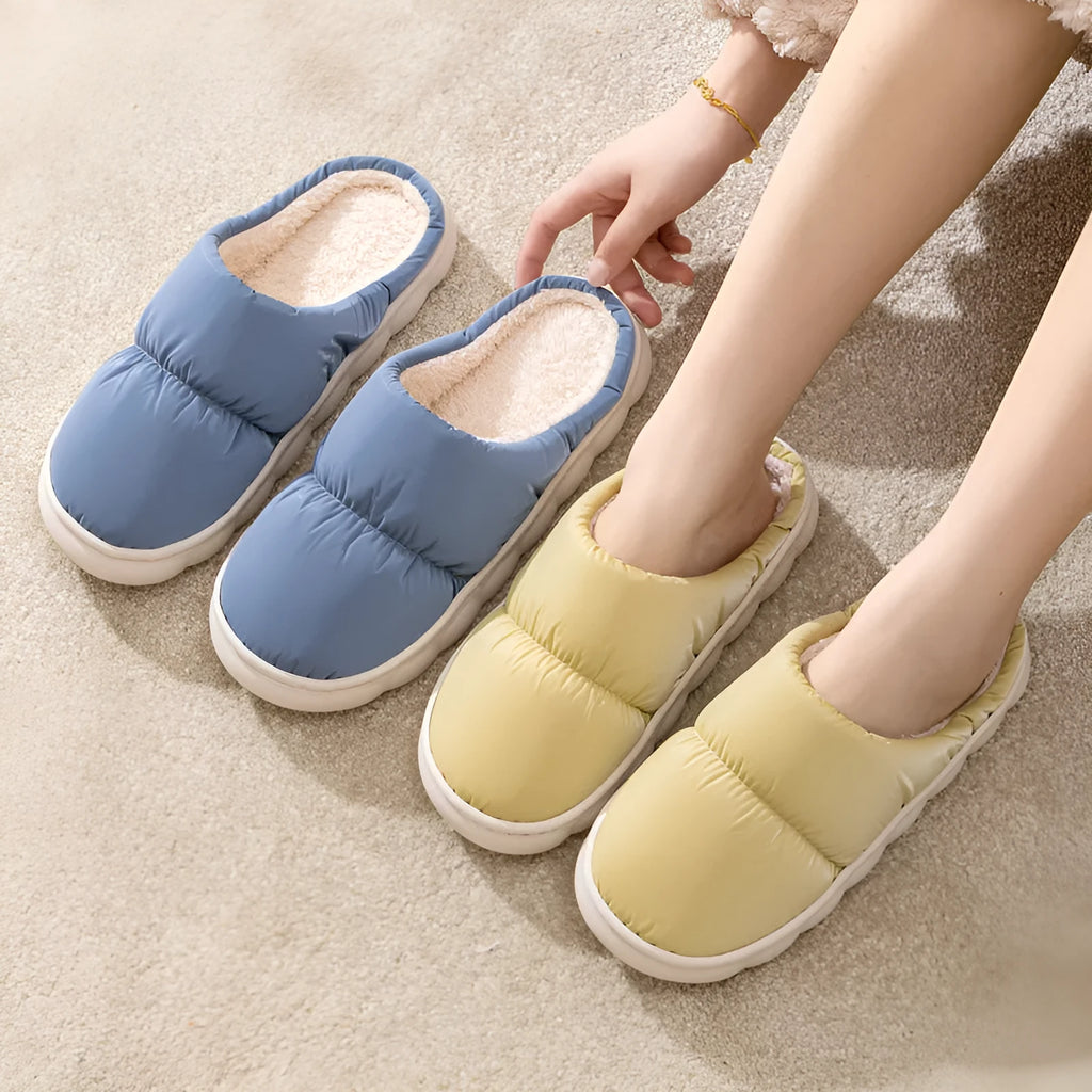 Blue winter house slippers with artificial leather upper, thick rubber sole, and plush lining.