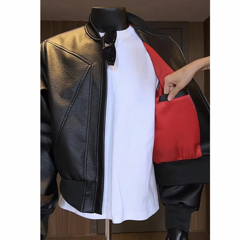 Man wearing a black slim-fit PU leather jacket with litchi pattern texture and extended 100cm length