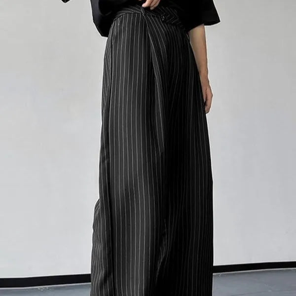 Men's black vertical striped pleated casual trousers showing elastic fabric and detailed sizing