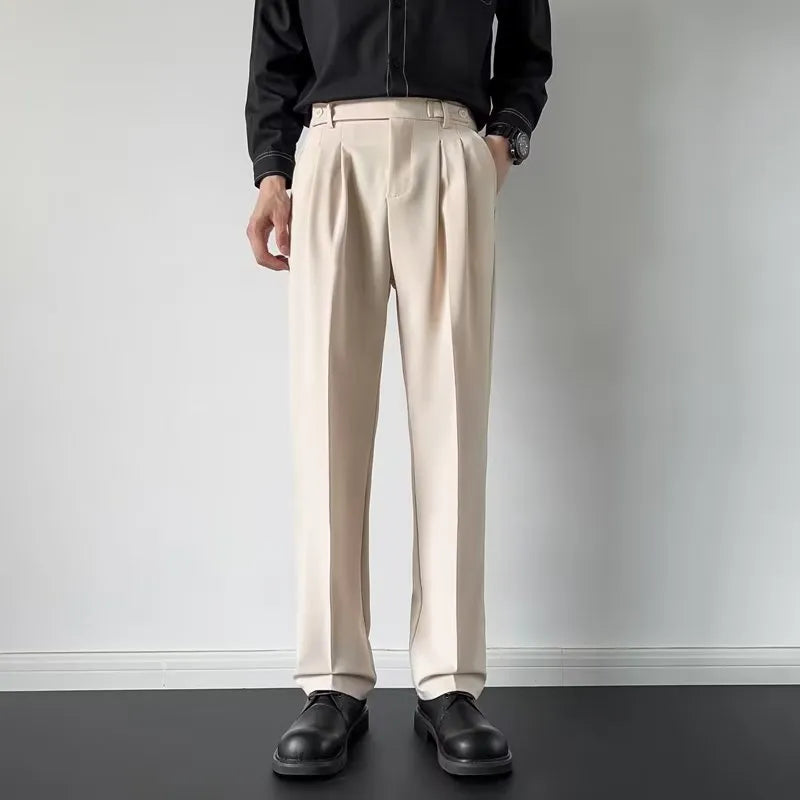 Men's apricot and black straight-leg loose-fit suit trousers on a hanger.