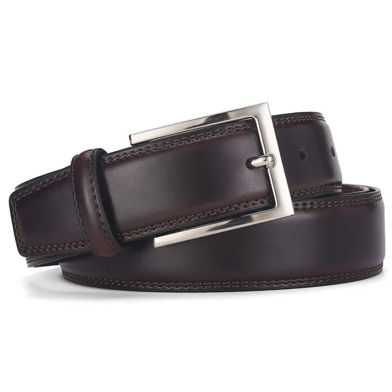 Men's black genuine leather belt with a silver alloy pin buckle on a plain background.