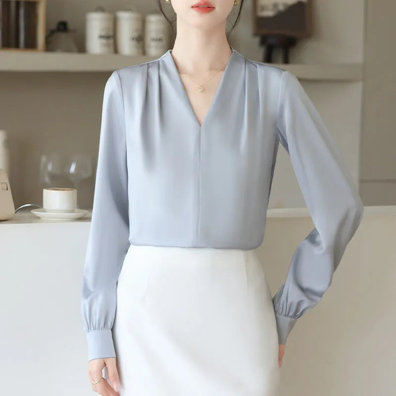 Women's long sleeve solid blue satin shirt with slim fit and 3D stitching, front view