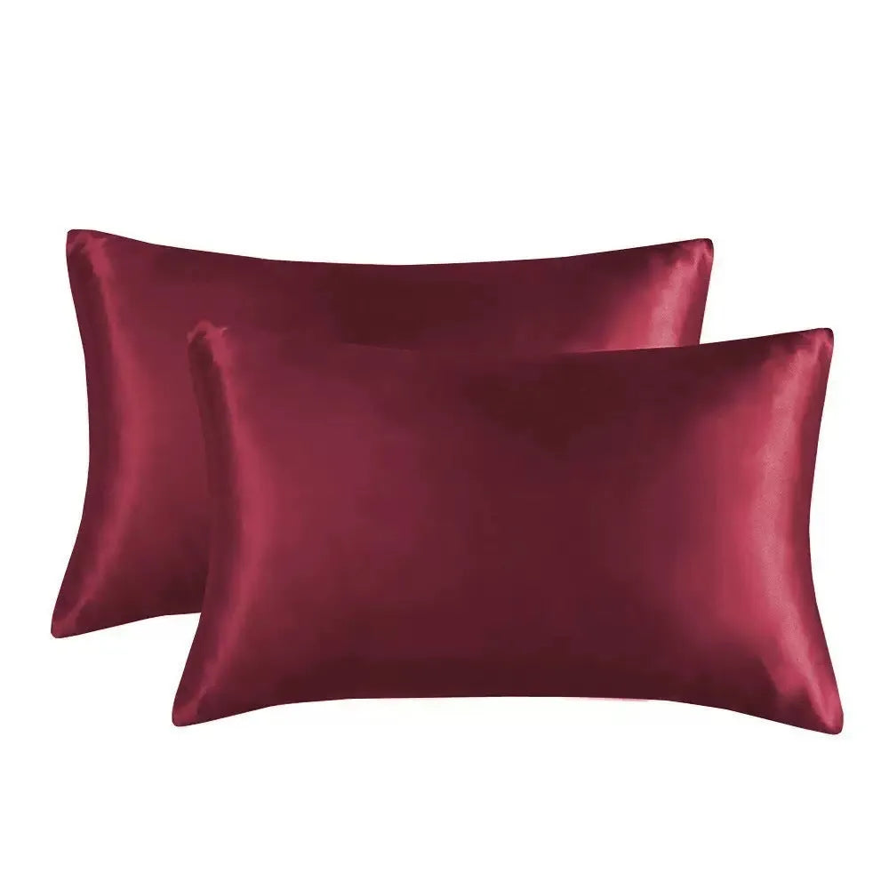 A pair of solid colour satin cloth pillowcases made from polyester fabric, showing one of 13 available colour options.