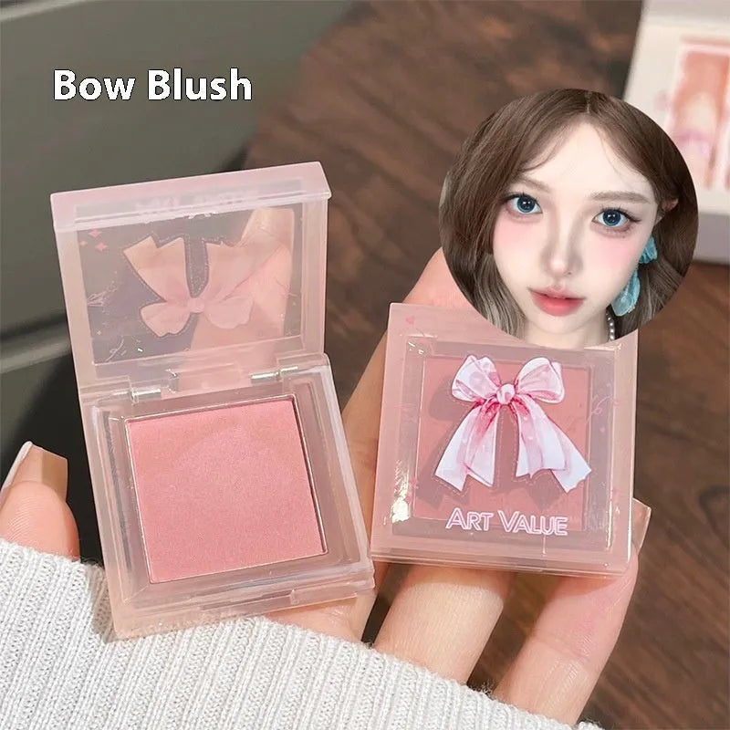 Butterfly Box pink makeup set with four lip mud products, powder blusher and necklace