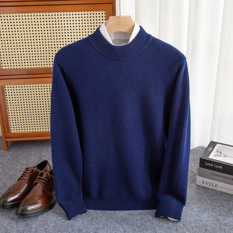 Man wearing a loose-fit half-turtleneck wool sweater in a neutral colour.