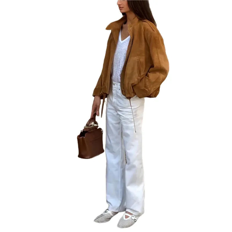 Loose fit solid colour retro jacket with long sleeves on a hanger.