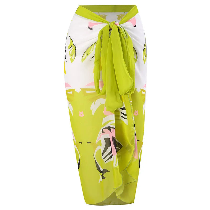 Women's blue fairy print one-piece swimsuit with a matching sheer gauze dress skirt attached.