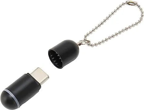 Black capsule-shaped infrared remote control with Lightning, Type-C, and Micro-USB ports.