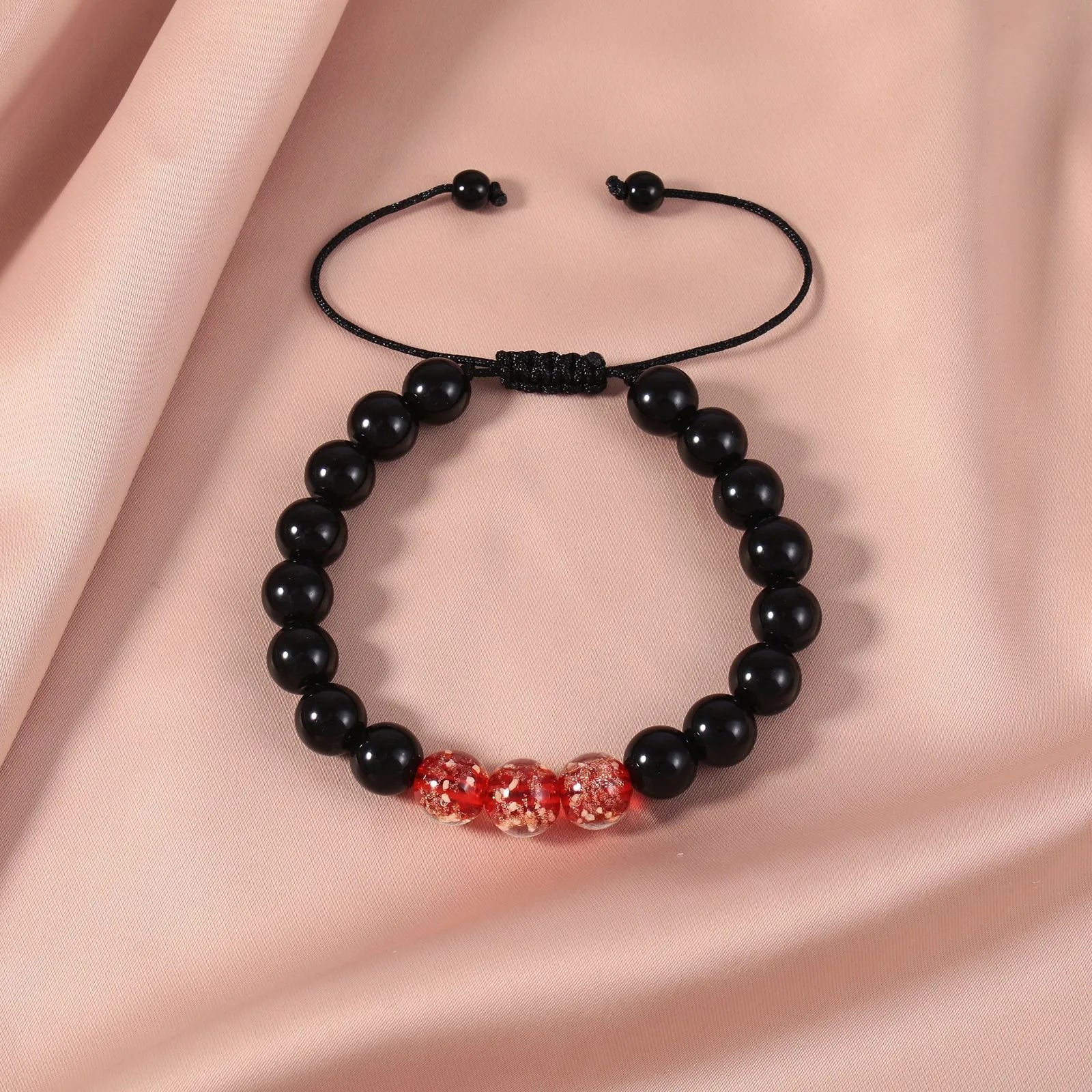 Beaded adjustable luminous bracelet in six colours: black, red, green, pink, blue, sapphire blue, glass or coloured glaze beads, geometric shape