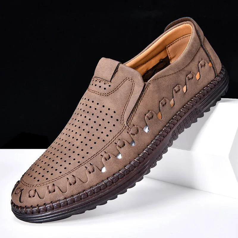 Men's brown slip-on casual shoes with artificial PU upper and flat PVC sole, showing sewing line details