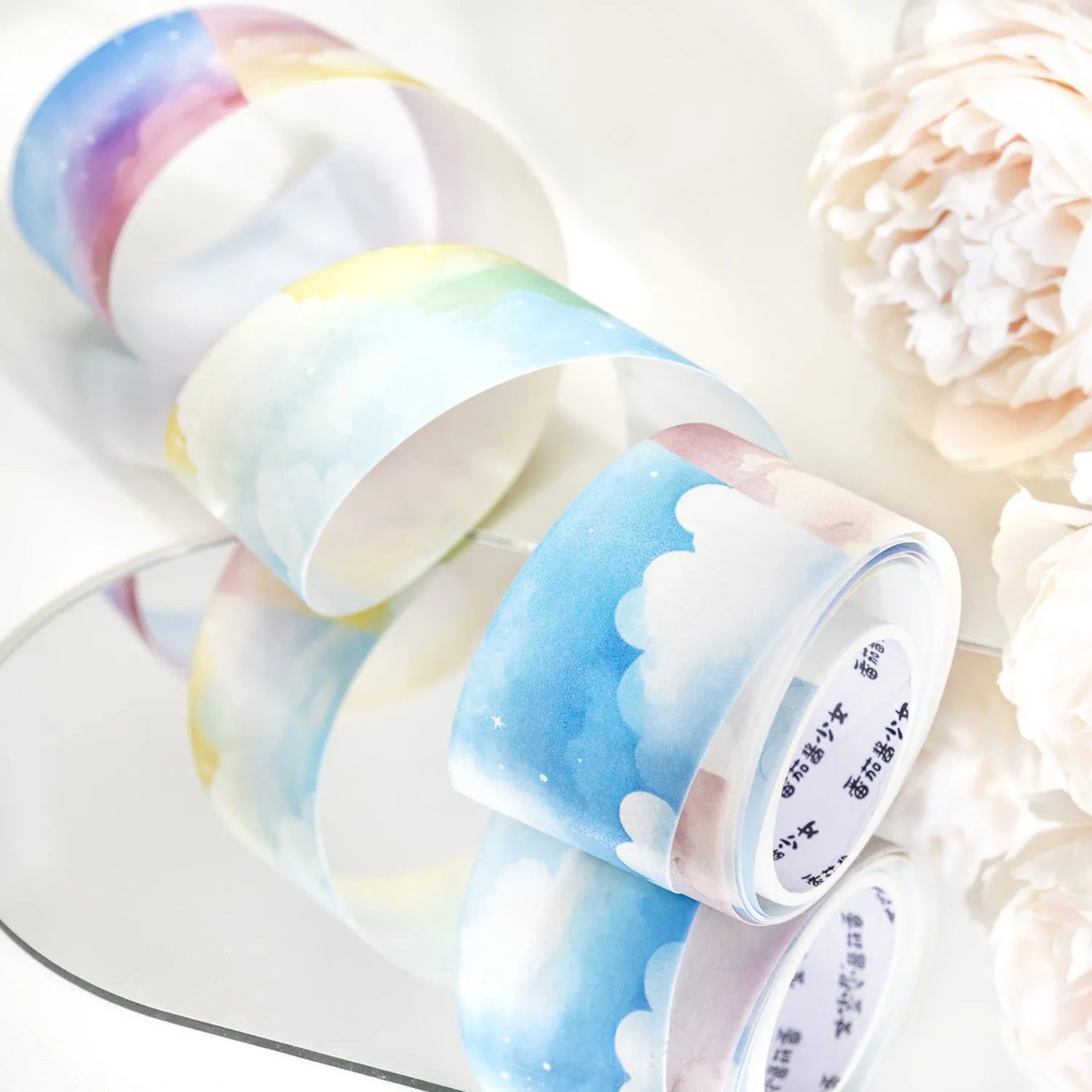 Roll of Japanese paper decorative tape with sky patterns including clouds and nebula, showing 30mm width.