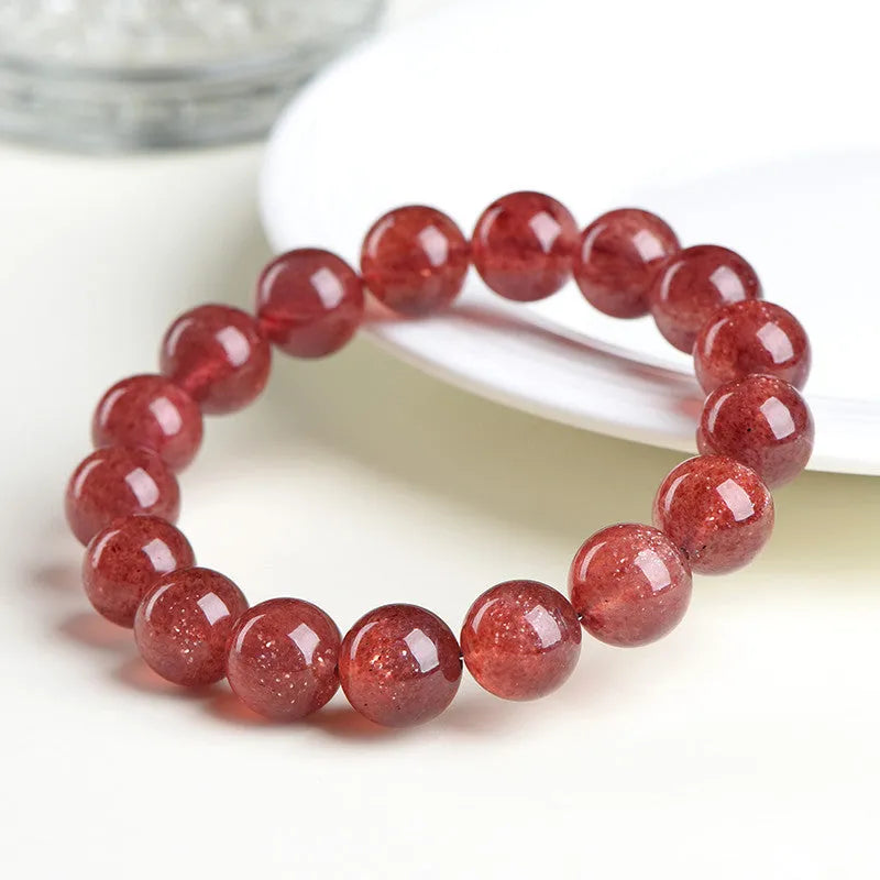 Natural strawberry quartz geometric bead bracelet showing colour and size options for men and women.