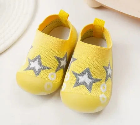 Baby soft sole non-slip walking shoes in cream yellow with fly woven cotton upper and natural rubber sole