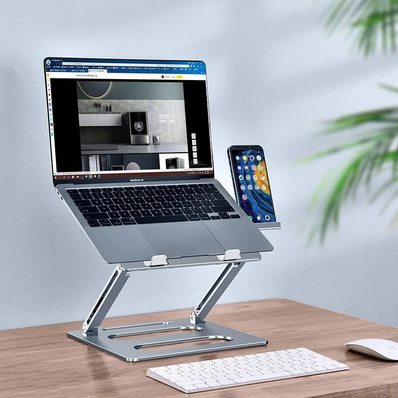 Silver adjustable aluminum laptop stand with laptop on desk at 340mm height