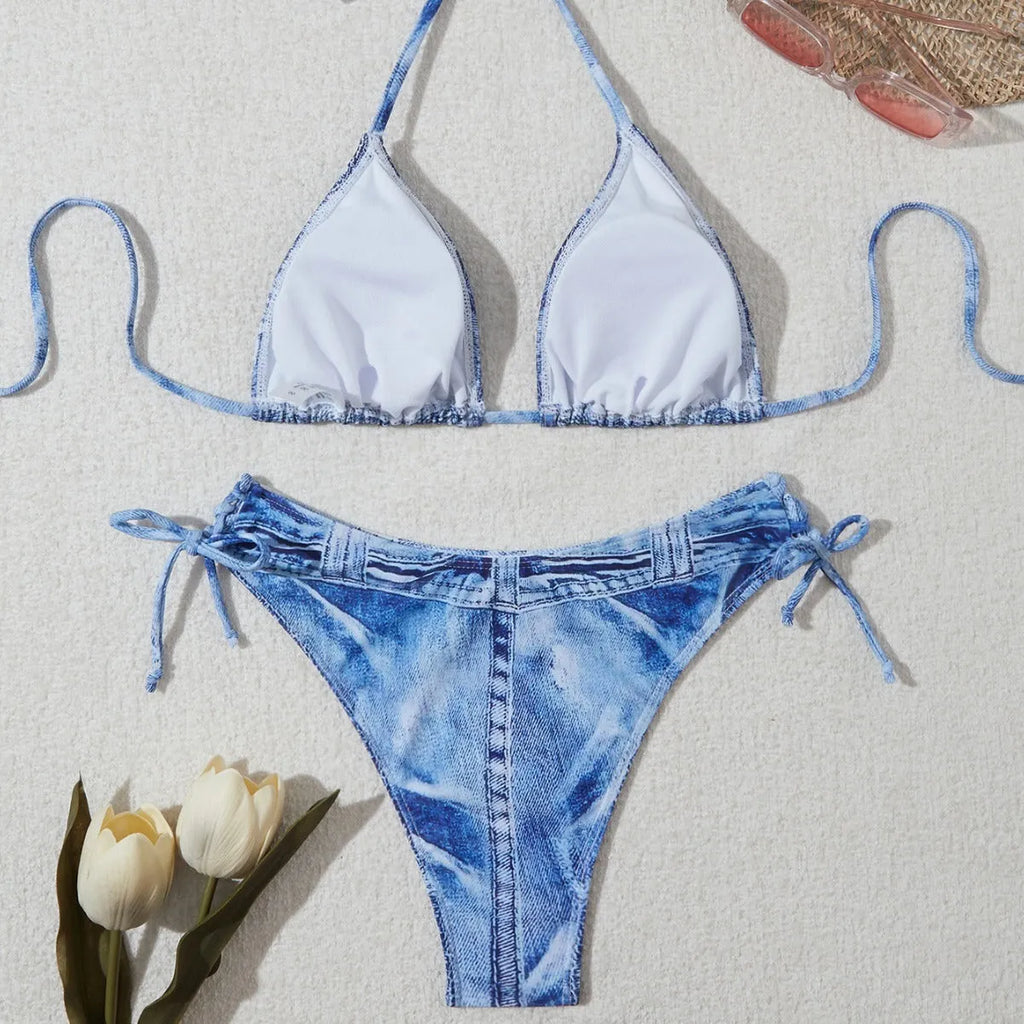 Denim blue printed women's bikini set with strappy triangle top and matching bottoms on a neutral background.