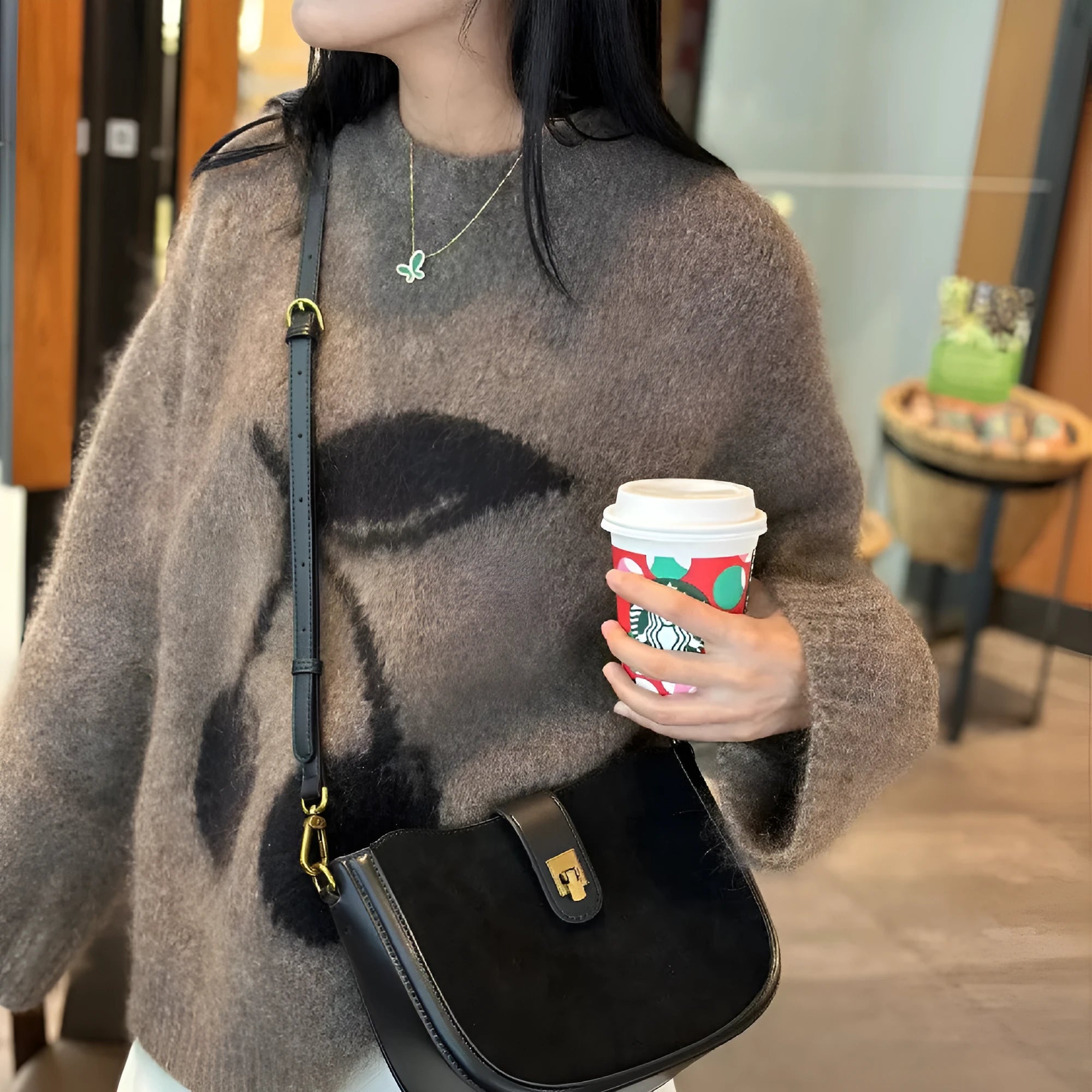 Genuine leather crossbody bag for women in black, 24x9x19cm, with sandwich pocket and adjustable strap