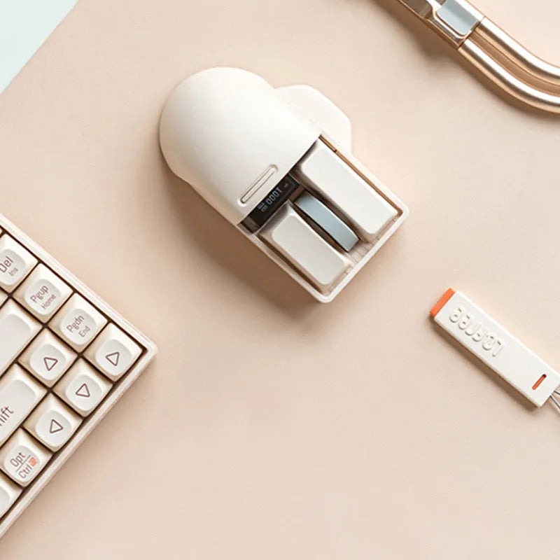 Xiaoqiao Tofu coloured wireless mouse with ergonomic shape on a desk