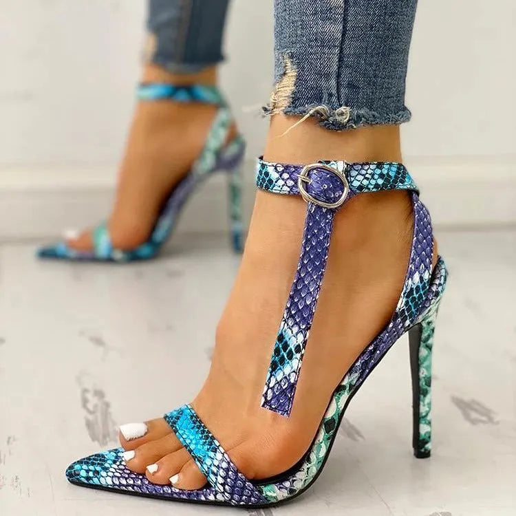 Blue women's high heels with hollow-out detail and buckle strap, pointed toe, European serpentine style.