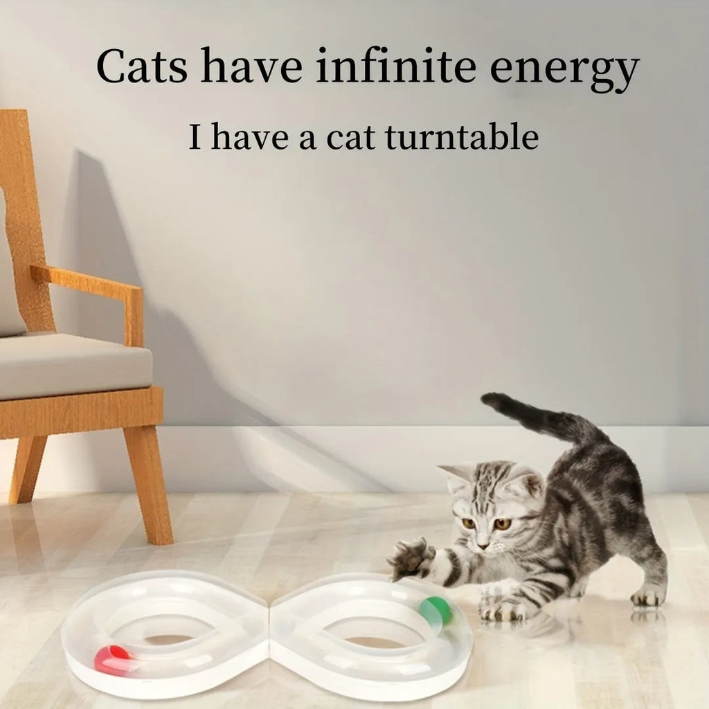 Blue cat turntable toy with rotating ball track and feather teaser wand on floor
