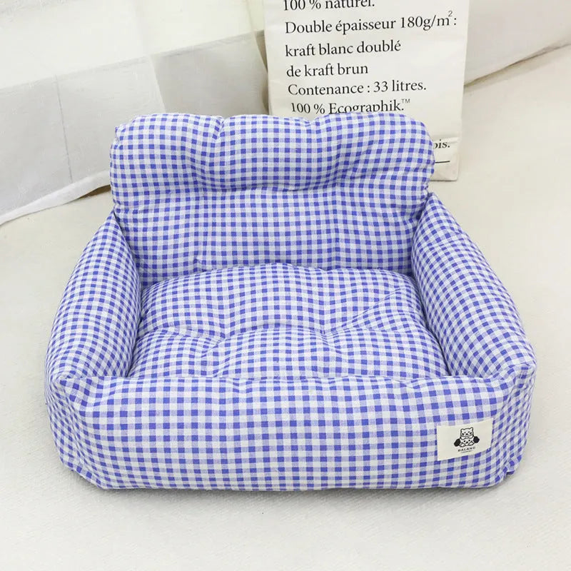 Blue plaid and grey cloth dog car seat nest shown in small and large sizes.