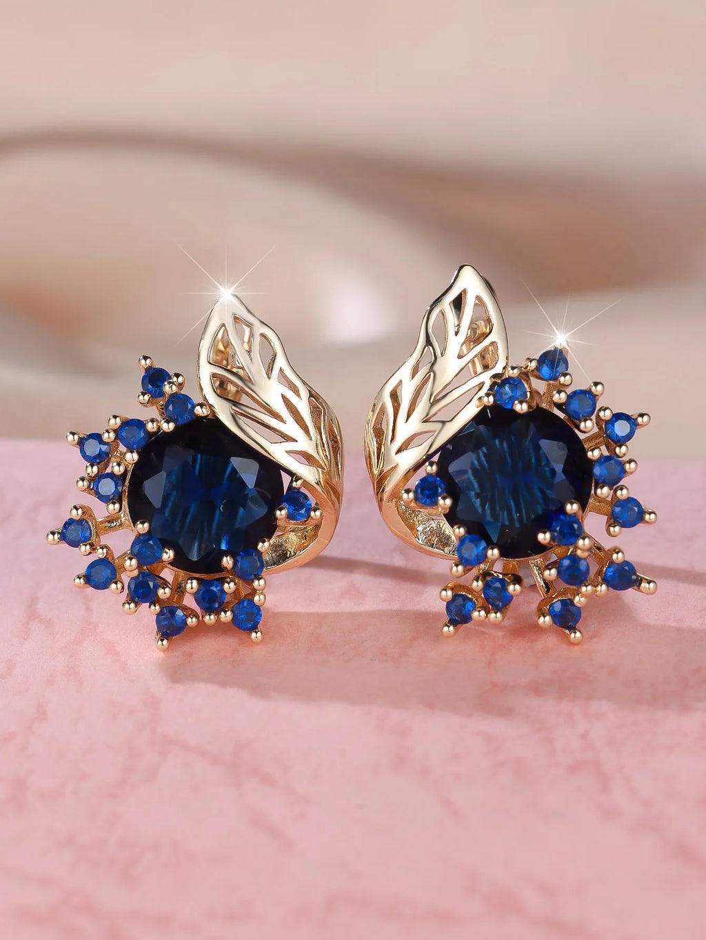 Round flower feather earrings with zircon stones in champagne gold finish, showing six colour variations