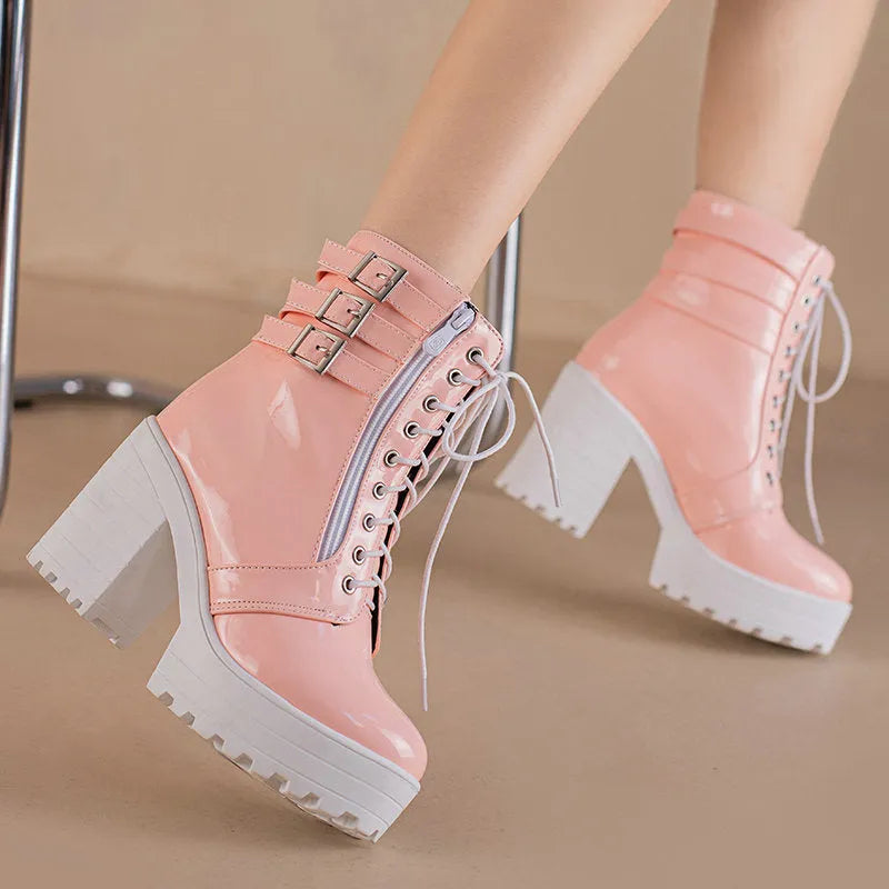 Women's black thick-heeled short boots with lace-up front and round toe, showing waterproof platform detail