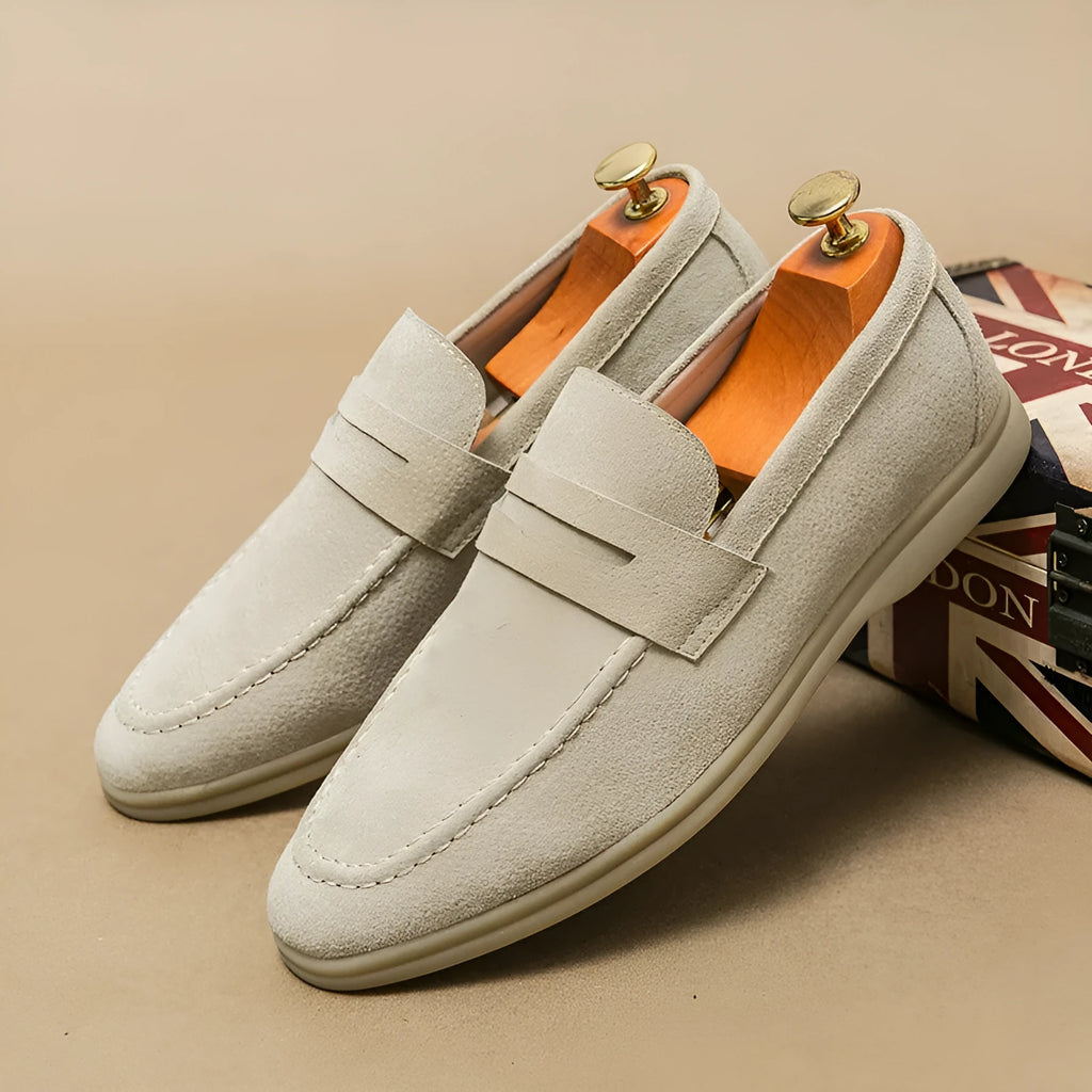 Men's black leather slip-on casual shoes with a round toe and rubber sole.
