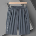 Men's black nylon quick-drying sports shorts with loose fit and elastic waistband.