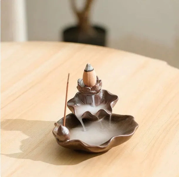 Square purple clay ceramic reverse flow incense burner with crystal glaze, featuring lotus and plum blossom designs.