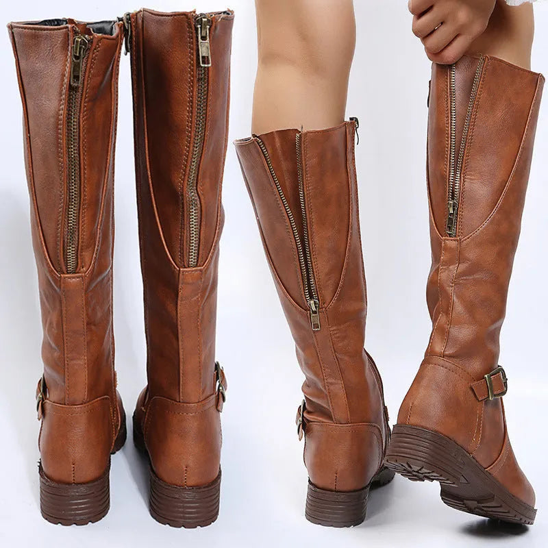 Women's solid colour knight boots with square heel, round toe, and belt buckle detail on a white background