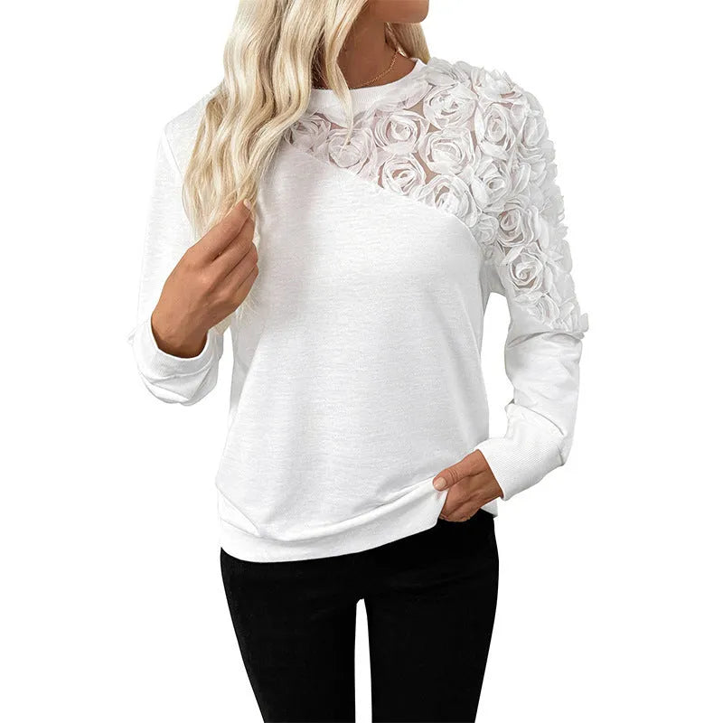 White floral print long sleeve polyester top with loose fit and pullover design