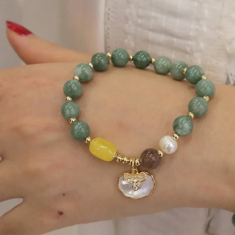 Natural green jade shell bracelet on a woman's wrist, casual style