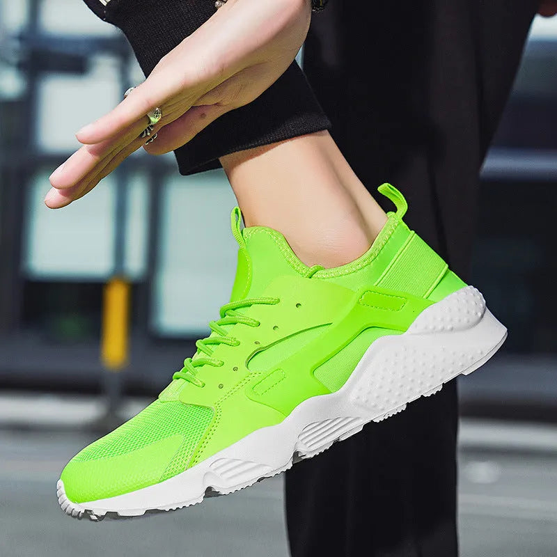 Men's low-top casual sneakers with mesh upper, round toe, and cross shoulder straps in multiple colour options