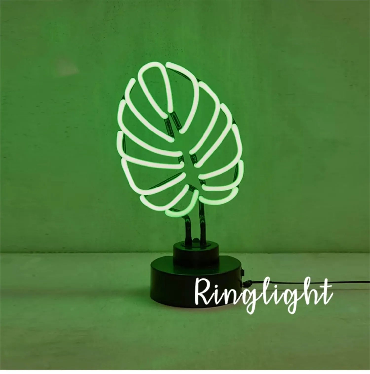 White tube bamboo shape desktop lamp emitting green light, with USB cable.