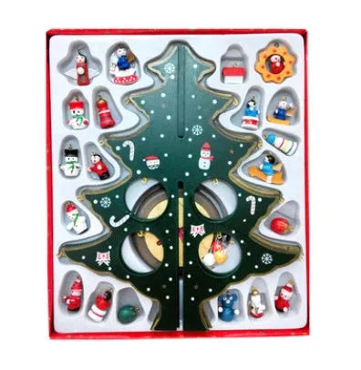 Set of three hand-painted wooden Christmas trees in green and red, 36cm tall, on a table