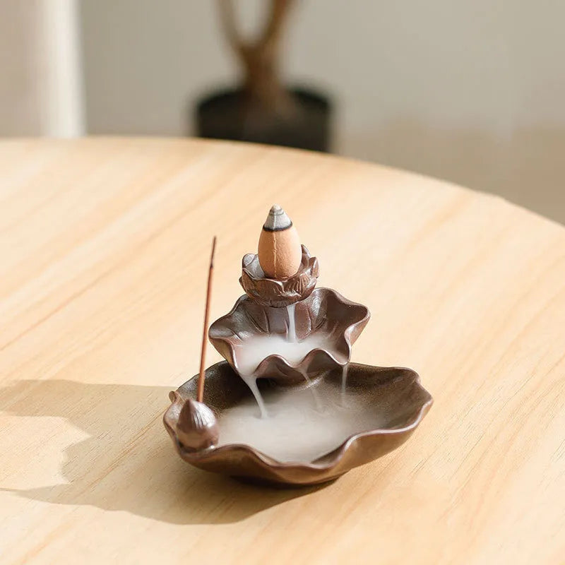 Square purple clay ceramic reverse flow incense burner with crystal glaze, featuring lotus and plum blossom designs.