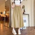 Camel women's casual loose fit a-line skirt with elastic waist on model