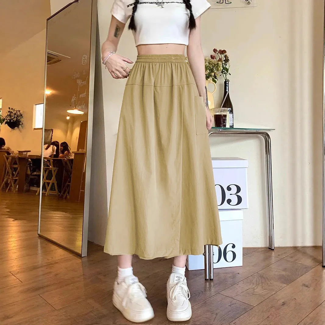 Camel women's casual loose fit a-line skirt with elastic waist on model