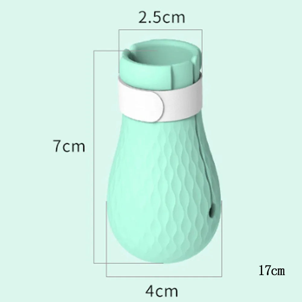 Four green silicone cat foot covers for scratch protection during pet washing and medicine administration