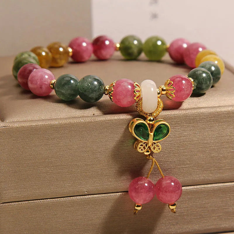 Colourful tourmaline butterfly pendant bracelet with alloy inlay and rhinestone accents on women's wrist